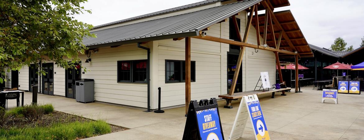 The exterior of the Barn with staff appreciation wayfinding signs.