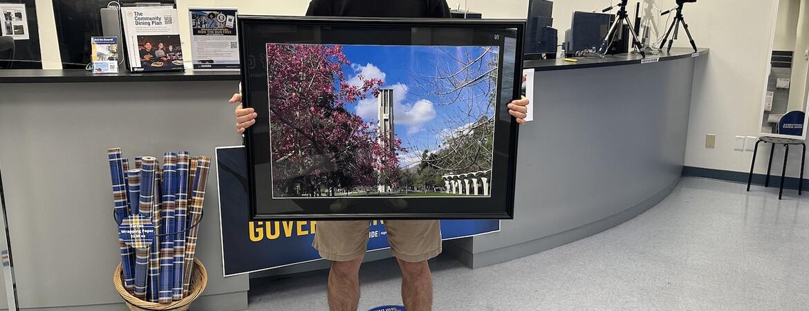 Han Li R'Card Contest Winner with framed winner.